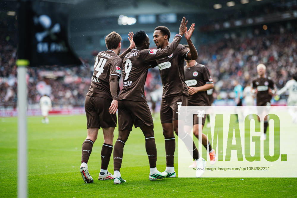 2. Bundesliga: FC St. Pauli vs. Karlsruher SC, October 11, 2026, GOAL, CELEBRATION by Abdoulie Ceesay of FC St. Pauli, 9–1–0; pictured here are Connor Metcalfe of FC St. Pauli, No. 24, and Youssoupha Niang of FC St. Pauli, No. 7; soccer, 2. Bundesliga, Matchday 7: FC St. Pauli vs. Karlsruher SC on October 11, 2026, at Millerntor Stadium, Hamburg. DFL regulations prohibit any use of photographs as image sequences and or quasi-video.