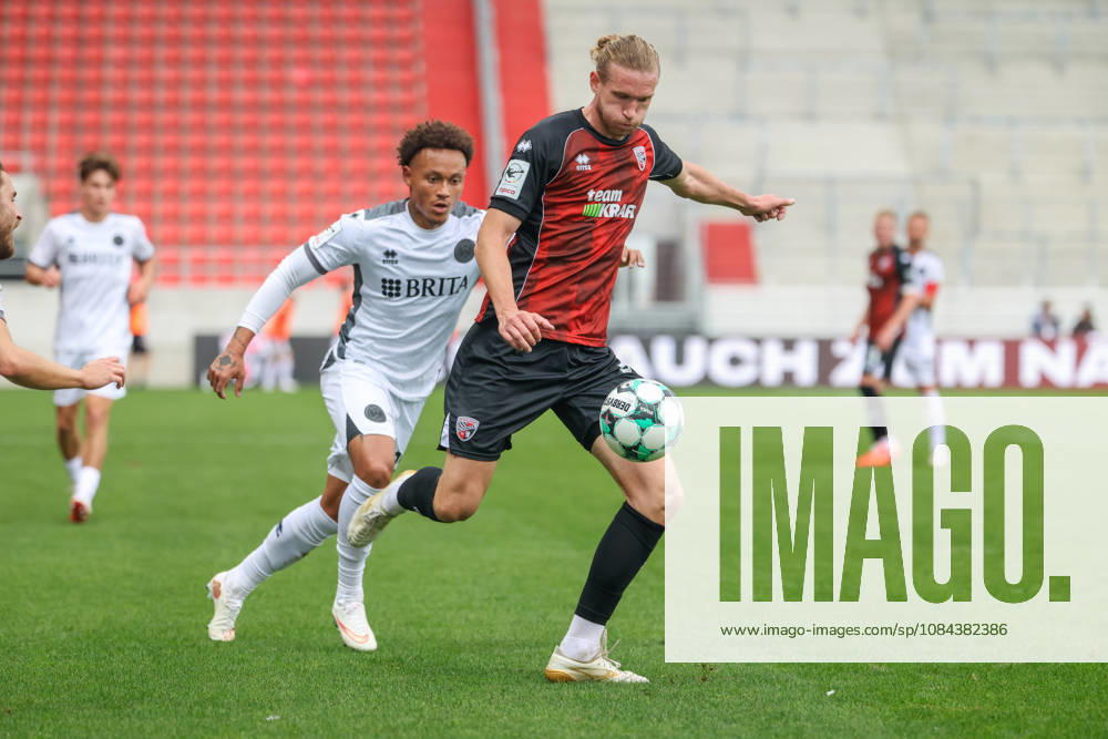Ingolstadt, Germany October 11, 2026 3rd League 2026–2027 Matchday 8 FC Ingolstadt 04 vs. SV Wehen Wiesbaden Pictured from left in a tackle: Roberto Massimo (SVWW) and Vinko Sapina (FCI). DFB and DFL regulations prohibit any use of photographs as image sequences and or quasi video