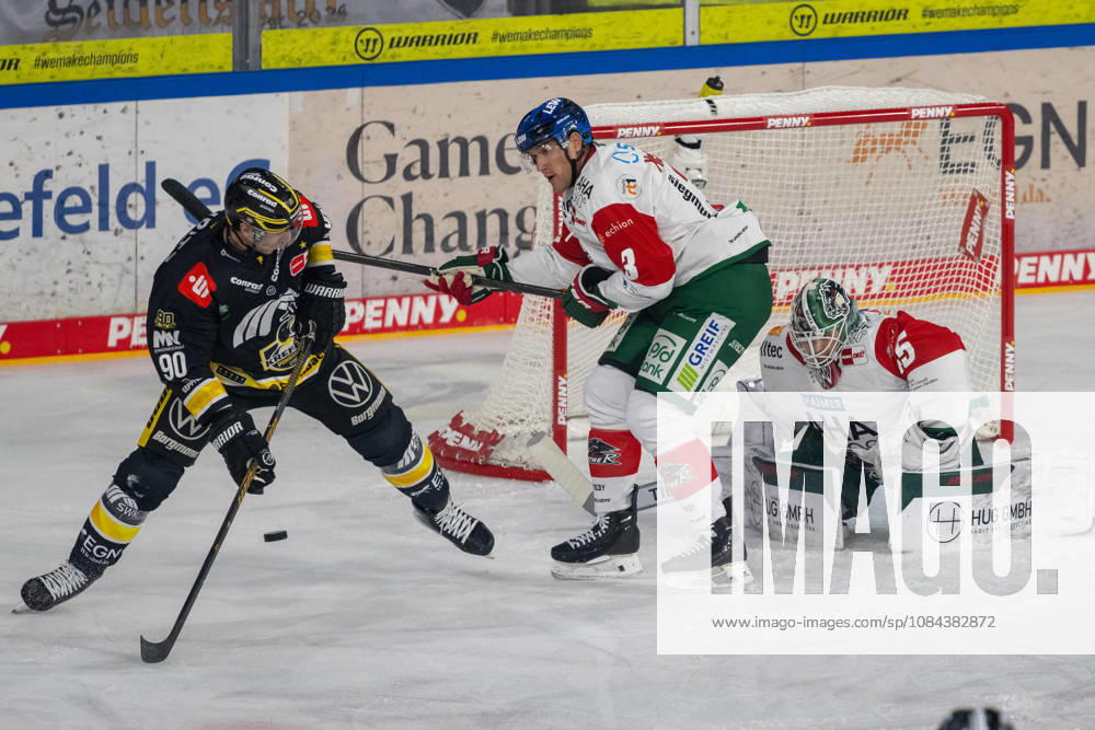 A battle between Adam Payerl of the Krefeld Pinguine (90) and Alec McCrea of the Augsburger Panther (03) in front of the net of Tobias Ancicka of the Augsburger Panther (45). Krefeld Pinguine vs. Augsburger Panther, ice hockey, Penny DEL, Matchday 08, 2026–2027 season, October 11, 2026 Krefeld Pinguine vs. Augsburger Panther, ice hockey, Penny DEL, Matchday 08, 2026–2027 season, October 11, 2026, Krefeld