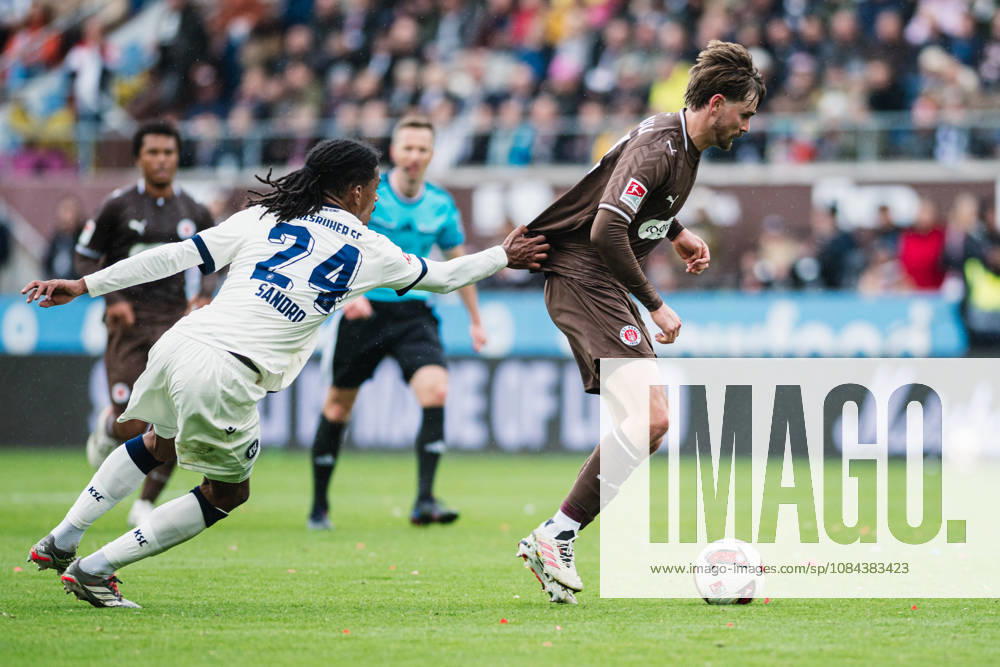 2. Bundesliga: FC St. Pauli vs. Karlsruher SC, October 11, 2026; Sandro Tromoulet (Karlsruher SC), 24, saves a shot by Connor Metcalfe (FC St. Pauli), 24; soccer, 2. Bundesliga, Matchday 7: FC St. Pauli vs. Karlsruher SC on October 11, 2026, at Millerntor Stadium, Hamburg. DFL regulations prohibit any use of photographs as image sequences and or quasi-video.