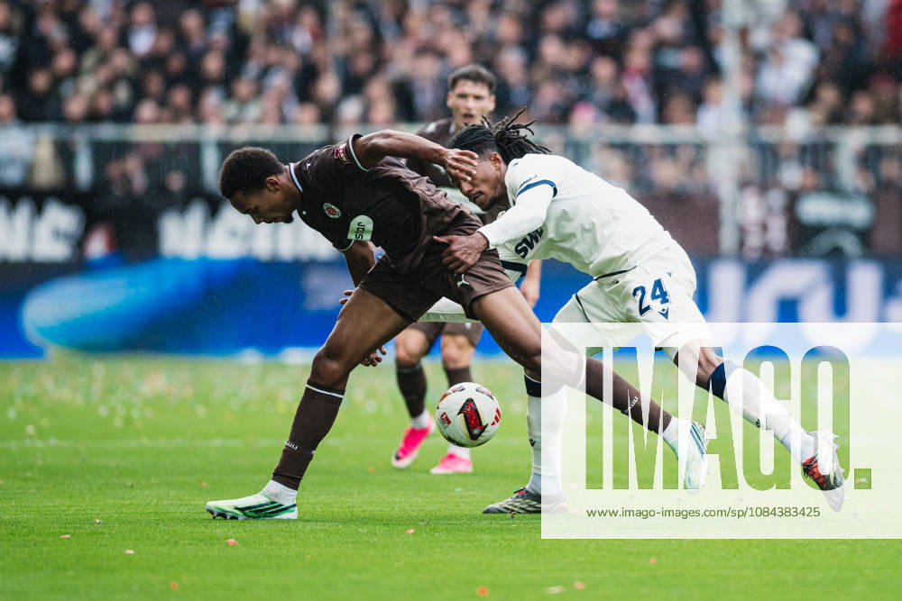 2. Bundesliga: FC St. Pauli vs. Karlsruher SC, October 11, 2026—Sandro Tromoulet (Karlsruher SC, No. 24) vs. Youssoupha Niang (FC St. Pauli, No. 7), tackle, soccer, 2. Bundesliga, Matchday 7: FC St. Pauli vs. Karlsruher SC on October 11, 2026, at Millerntor Stadium, Hamburg. DFL regulations prohibit any use of photographs as image sequences and or quasi-video.