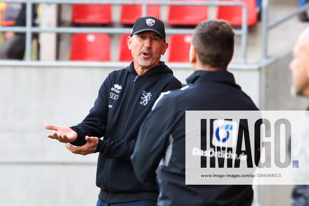 Coach Achim Beierlorzer, head coach of FC Ingolstadt 04, is seen discussing with the fourth official during the match between FC Ingolstadt 04 and SV Wehen Wiesbaden on October 11, 2026, DFB regulations prohibit any use of photographs as image sequences and or quasi-video. GER, Soccer, 3. Liga, Matchday 8, FC Ingolstadt 04 vs. SV Wehen Wiesbaden, October 11, 2026, Audi Sportpark Ingolstadt