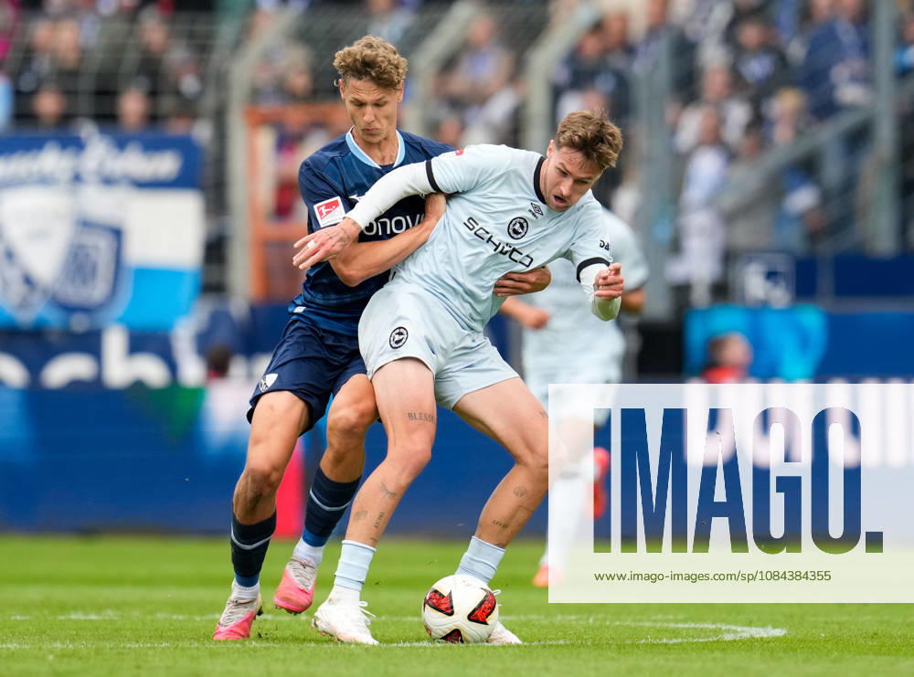 Tom Meyer of VfL Bochum 1848, No. 34, in a tackle with Joel Grodowski of DSC Arminia Bielefeld, No. 11 (GER), VfL Bochum 1848 vs. DSC Arminia Bielefeld, 2. Bundesliga, Matchday 7, 2026–27 season, Vonovia Ruhrstadion, Bochum, October 11, 2026 DFL REGULATIONS PROHIBIT ANY USE OF PHOTOGRAPHS AS IMAGE SEQUENCES AND OR QUASI-VIDEO VfL Bochum 1848 vs. DSC Arminia Bielefeld, 2. Bundesliga, Matchday 7, 2026–27 season, October 11, 2026, Bochum