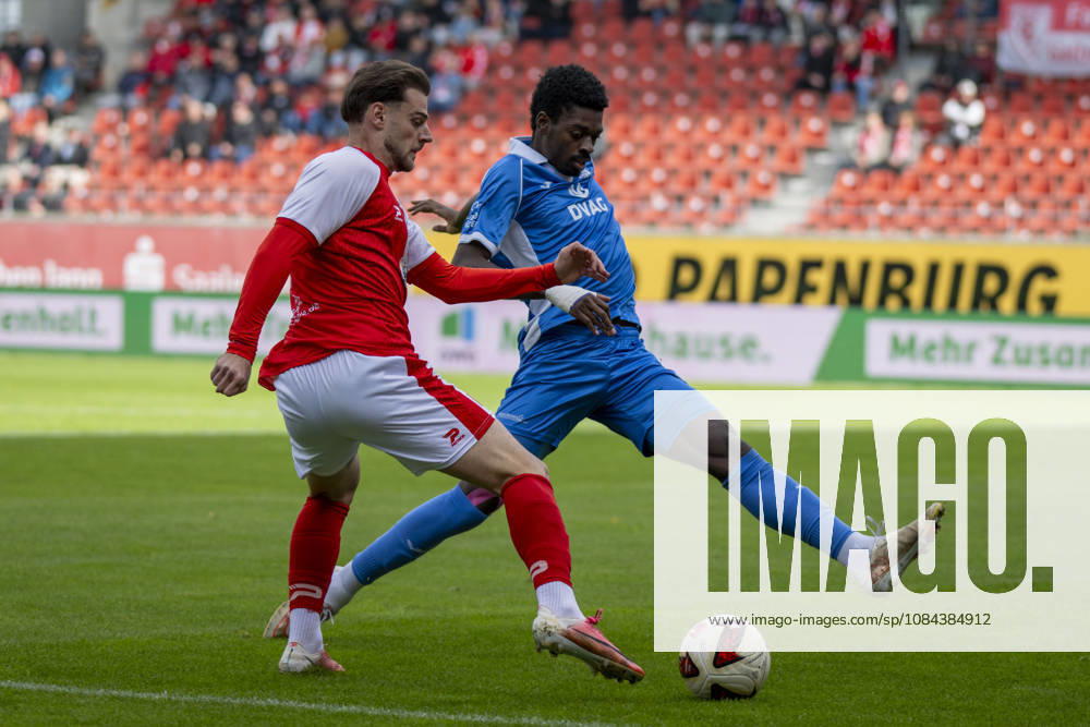 Regionalliga Nordost, Season 26-27: Hallescher FC vs. RSV Eintracht 1949 e.V., Halle, Germany, October 11, 2026. Pictured, from left: Max Kulke (Halle) and Nathanael Kukanda (RSV), Halle Saale Leuna Chemie Stadium, Saxony-Anhalt, Germany