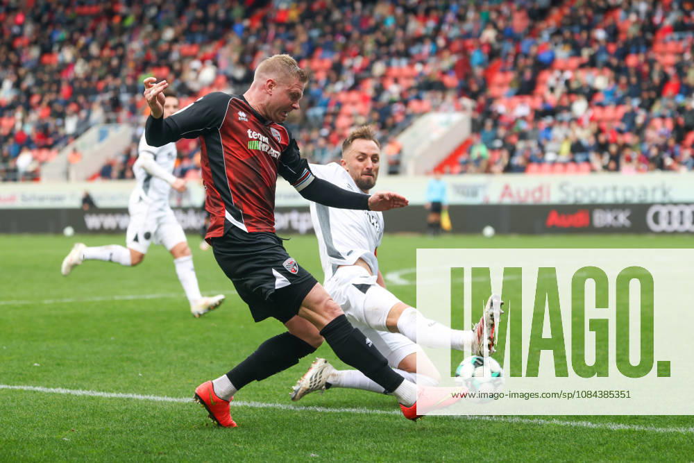 Ingolstadt, Germany, October 11, 2026, 3rd League 2026–2027, Matchday 8: FC Ingolstadt 04 vs. SV Wehen Wiesbaden. Pictured, from left, in a tackle: Lars Lokotsch (FCI) and Florian Hübner (SVWW). DFB and DFL regulations prohibit any use of photographs as image sequences and or quasi-video
