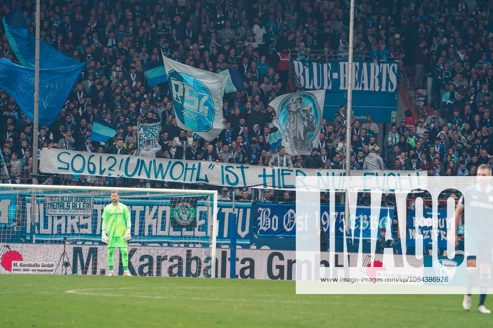 German Soccer 2. Bundesliga 2026–2027, Matchday 7: VfL Bochum vs. Arminia Bielefeld, Vonovia Ruhrstadion, Bochum. VfL Bochum fans unfurl a banner in the East Stand reading Only you feel out of place here and wave blue-and-white flags. Bochum, Vonovia Ruhrstadion, Germany