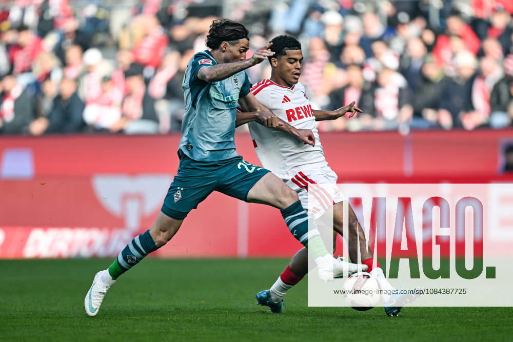 From left to right in a one-on-one: Joe Scally, Mönchengladbach, 29; Jahmai Simpson Pusey, Cologne, 22; 11; 10; 2026 ¢ Soccer ¢ 1. FC Cologne vs. Borussia Mönchengladbach, RheinEnergieStadion, Cologne, DFB DFL regulations prohibit any use of photographs as image sequences and or quasi-video NRW Germany