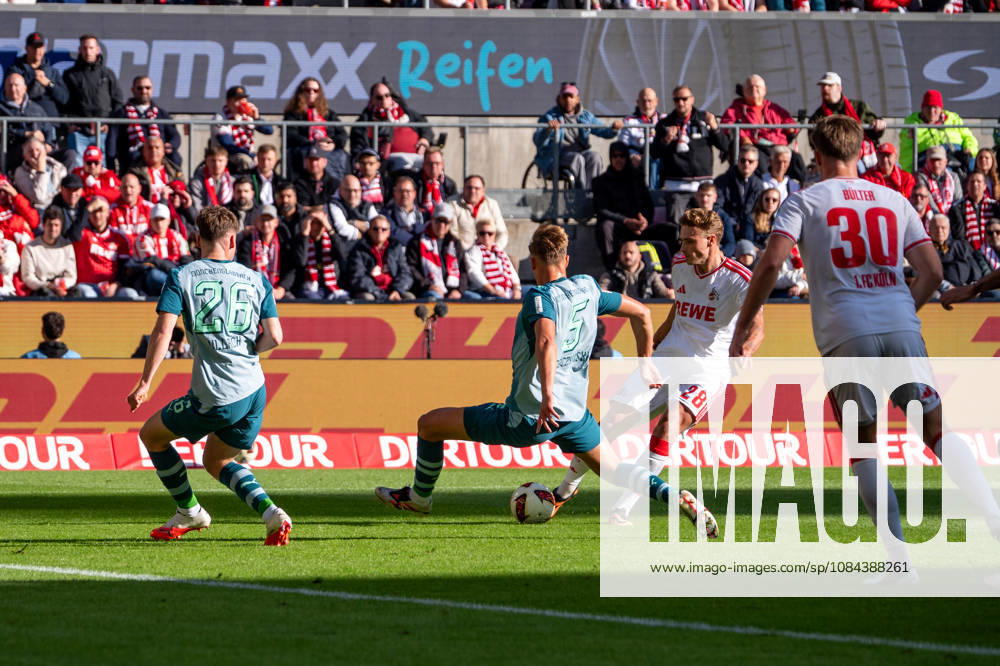 Germany 1 Bundesliga 2026–2027, Matchday 5, 1. FC Köln vs. Borussia Mönchengladbach, Sunday, October 11, 2026, RheinEnergie Stadium, Cologne, North Rhine-Westphalia, Sebastian Sebulonsen (1. FC Köln), 28, takes a shot on goal against Jan Leszczynski of Borussia Mönchengladbach, 5, and Lukas Ullrich of Borussia Mönchengladbach, 26, at RheinEnergie Stadium, Cologne, Germany