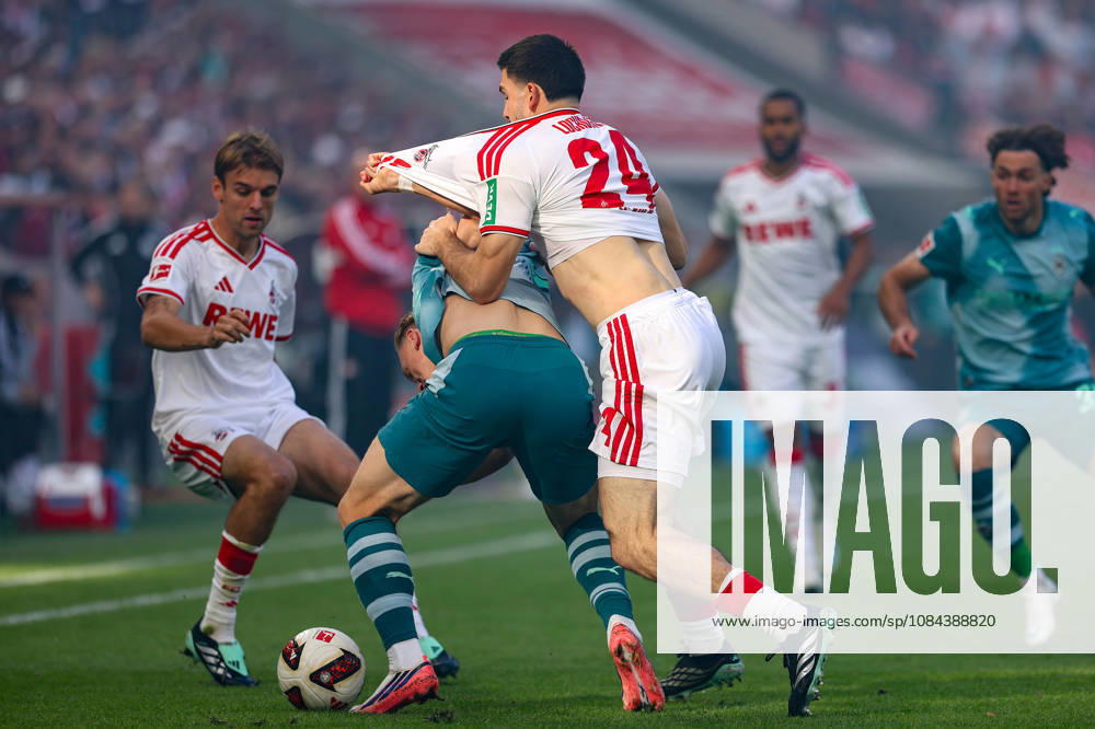 Soccer, Bundesliga, 1. FC Köln vs. Borussia Mönchengladbach, RheinEnergieSTADION, Matchday 5, 2026–2027 Season: Luka Lochoshvili of 1. FC Köln (No. 24) in a tackle against Isac Lidberg of Borussia Mönchengladbach (No. 3). DFB regulations prohibit any use of photographs as image sequences and or quasi-video. Photo: WilkowskixPressefotoKochx, North Rhine-WestGermany