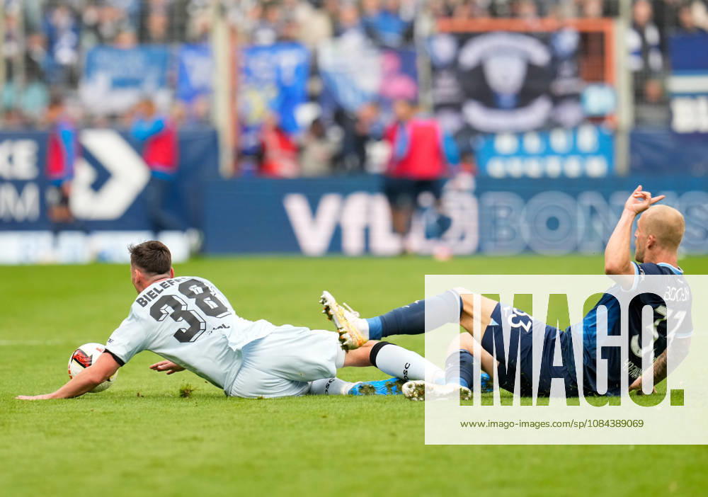 Marius Woerl of DSC Arminia Bielefeld, 38, in a tackle with Philipp Hofmann of VfL Bochum 1848, 33, GER, VfL Bochum 1848 vs. DSC Arminia Bielefeld, 2. Bundesliga, Matchday 7, 2026–27 season, Vonovia Ruhrstadion, Bochum, October 11, 2026 DFL regulations prohibit any use of photographs as image sequences and or quasi-video VfL Bochum 1848 vs. DSC Arminia Bielefeld, 2. Bundesliga, Matchday 7, 2026–27 Season, October 11, 2026, Bochum