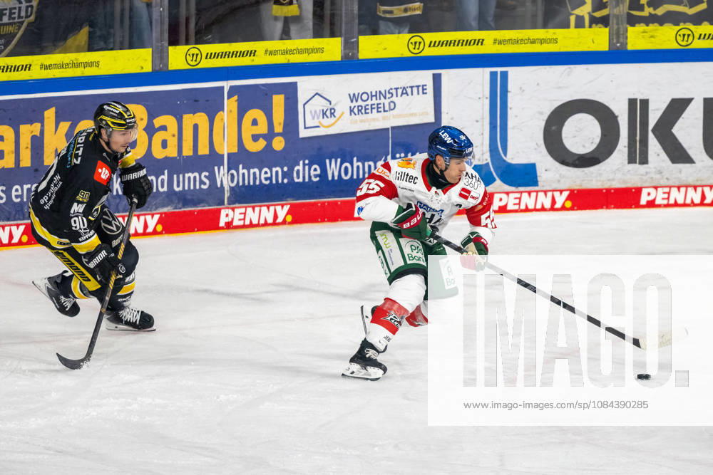 Adam Payerl of the Krefeld Pinguine (No. 90) attempts to engage in a battle for the puck with Ryan Button of the Augsburger Panther (No. 55). Krefeld Pinguine vs. Augsburger Panther, ice hockey, Penny DEL, Matchday 8, 2026–2027 season, October 11, 2026, Krefeld Pinguine vs. Augsburger Panther, ice hockey, Penny DEL, Matchday 8, 2026–2027 season, October 11, 2026, Krefeld