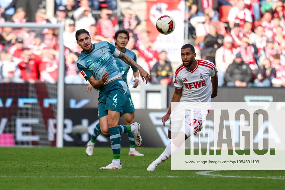 Soccer, Bundesliga, 1. FC Köln vs. Borussia Mönchengladbach, RheinEnergieSTADION, Matchday 5, 2026–2027 season: Kevin Diks of Borussia Mönchengladbach (4) in a tackle against Linton Maina of 1. FC Köln (37). DFB regulations prohibit any use of photographs as image sequences and or quasi-video. Photo: WilkowskixPressefotoKochx, North Rhine-Westphalia, Germany