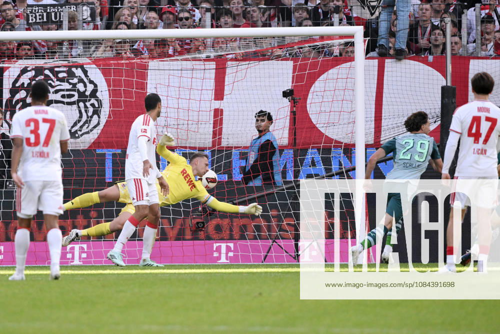 Joe Scally of Borussia Mönchengladbach (right) scores against goalkeeper Marvin Schwäbe of 1. FC Köln, tying the game at 1–1 on October 11, 2026, in the 1. Bundesliga, 2026–2027 season, Matchday 5, 1. FC Köln vs. Borussia Mönchengladbach. DFL regulations prohibit any use of photographs as image sequences and or quasi-video. Cologne, RheinEnergie Stadium, North Rhine-Westphalia, Germany Team2