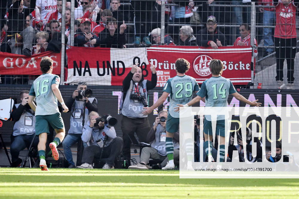 Joe Scally of Borussia Mönchengladbach, center, celebrates in front of the Cologne fan section; in the background, a photographer makes an offensive gesture. October 11, 2026, Soccer, Bundesliga, 2026–2027 season, Matchday 5, 1. FC Köln vs. Borussia Mönchengladbach. DFL regulations prohibit any use of photographs as image sequences and or quasi-video. Cologne, RheinEnergie Stadium, North Rhine-Westphalia, Germany Team2