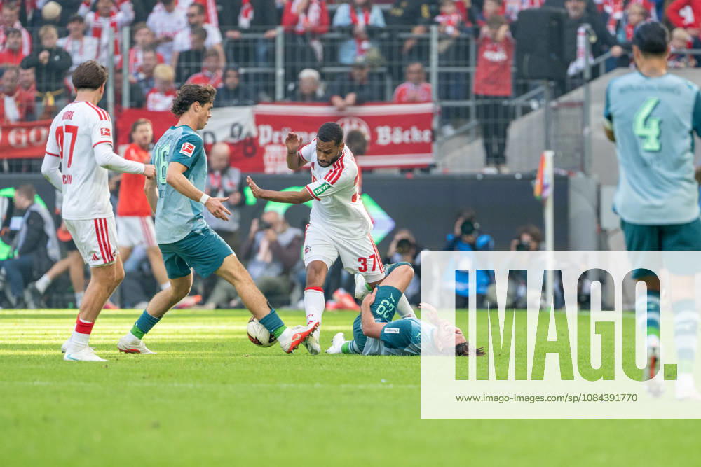 Mikey Moore, 1. FC Köln, 47, and Philipp Sander, Borussia Mönchengladbach, 16, battle it out with Linton Maina, 1. FC Köln, 37, Joe Scully (Borussia Mönchengladbach), 29, lies on the ground in pain; 1. FC Köln vs. Borussia Mönchengladbach, soccer, Bundesliga, Matchday 5, 2026–27 season, December 10, 2026, DFL regulations prohibit any use of photographs as image sequences and or quasi-video, 1. FC Köln vs. Borussia Mönchengladbach, soccer, Bundesliga, Matchday 5, 2026–27 season, December 10, 2026, Cologne