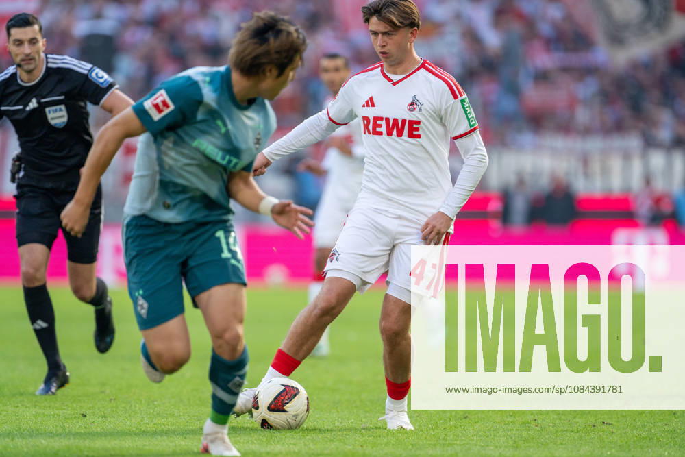 Daiki Haschioka, Borussia Mönchengladbach, No. 14, in a tackle with Mikey Moore, 1. FC Köln, No. 47; 1. FC Köln vs. Borussia Mönchengladbach, soccer, Bundesliga, Matchday 5, 2026–27 season, October 12, 2026. DFL regulations prohibit any use of photographs as image sequences and or quasi-video, 1. FC Köln vs. Borussia Mönchengladbach, Soccer, Bundesliga, Matchday 5, 2026–27 Season, October 12, 2026, Cologne