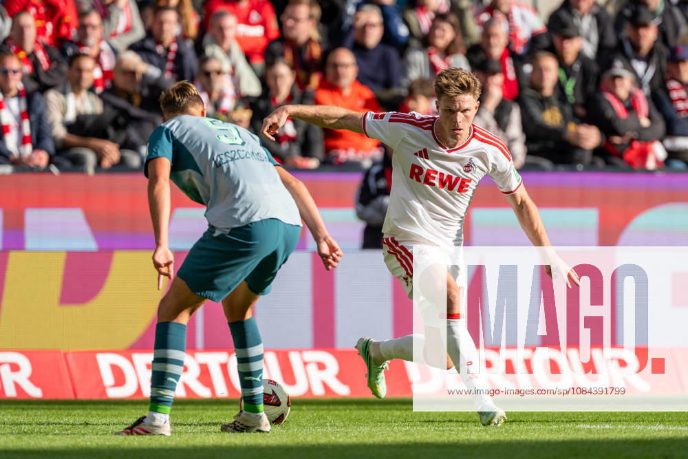 Jan Leszczynski, Borussia Mönchengladbach, No. 05, in a tackle with Marius Buelter, 1. FC Köln, No. 30; 1. FC Köln vs. Borussia Mönchengladbach, Soccer, Bundesliga, Matchday 5, 2026–27 season, October 12, 2026. DFL regulations prohibit any use of photographs as image sequences and or quasi-video, 1. FC Köln vs. Borussia Mönchengladbach, Soccer, Bundesliga, Matchday 5, 2026–27 Season, October 12, 2026, Cologne