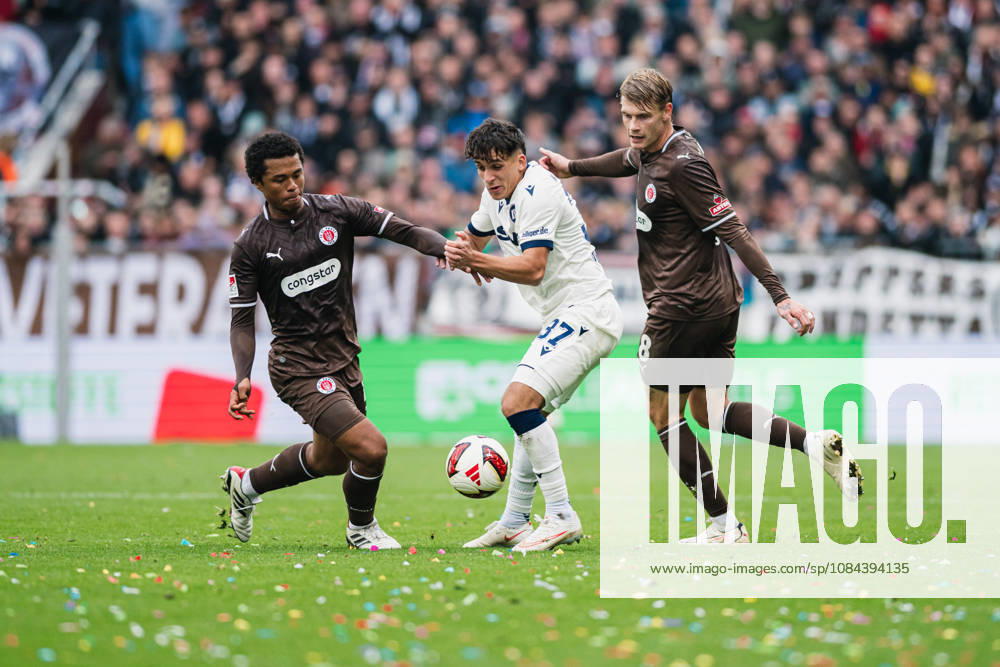 2. Bundesliga: FC St. Pauli vs. Karlsruher SC, October 11, 2026—Joel Fujita (FC St. Pauli, 16) and Eric Smith (FC St. Pauli, 8) vs. Jason Ponente Ramirez (Karlsruher SC, 37)—Soccer, 2. Bundesliga, Matchday 7: FC St. Pauli vs. Karlsruher SC on October 11, 2026, at Millerntor Stadium, Hamburg. DFL regulations prohibit any use of photographs as image sequences and or quasi-video.