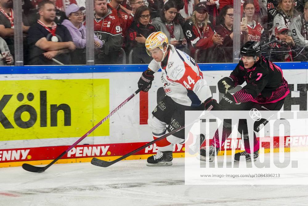 Ice Hockey: Penny DEL, Matchday 8—Cologne Sharks vs. Nuremberg Ice Tigers on October 11, 2026, at the Lanxess Arena in Cologne; Josef Eham (Nuremberg), left: Carlos Händel (Cologne), right: In accordance with the guidelines of the DEL (German Ice Hockey League), the publication and further use of the images in electronic media and on devices of any kind during the game is not permitted.