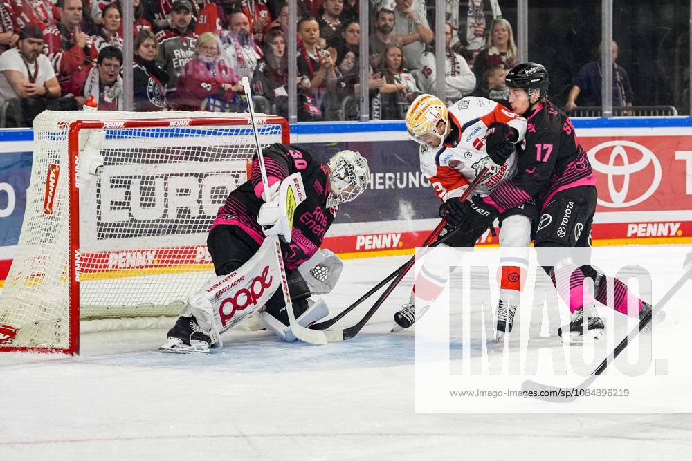 Ice Hockey: Penny DEL, Matchday 8—Cologne Sharks vs. Nuremberg Ice Tigers on October 11, 2026, at the Lanxess Arena in Cologne. Janne Juvonen (Cologne), left: Greg Meireles (Nuremberg), center: Jan Luca Sennhenn (Cologne), right: In accordance with the regulations of the DEL (German Ice Hockey League), the publication and further use of the footage in electronic media and on devices of any kind during the game is not permitted.