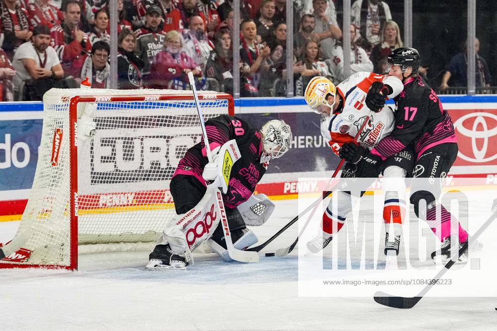 Ice Hockey: Penny DEL, Matchday 8—Cologne Sharks vs. Nuremberg Ice Tigers on October 11, 2026, at the Lanxess Arena in Cologne. Janne Juvonen (Cologne), left: Greg Meireles (Nuremberg), center: Jan Luca Sennhenn (Cologne), right: In accordance with the regulations of the DEL (German Ice Hockey League), the publication and further use of the footage in electronic media and on devices of any kind during the game is not permitted.