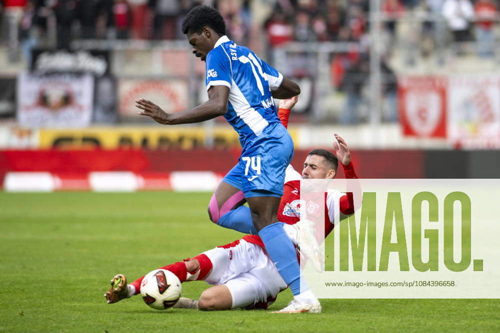 Regionalliga Northeast, Season 26-27: Hallescher FC vs. RSV Eintracht 1949 e.V., Halle, Germany, October 11, 2026. Pictured, from left: Nathanael Kukanda (RSV) and Marius Hauptmann (Halle). Halle-Saale-Leuna Chemie Stadium, Saxony-Anhalt, Germany