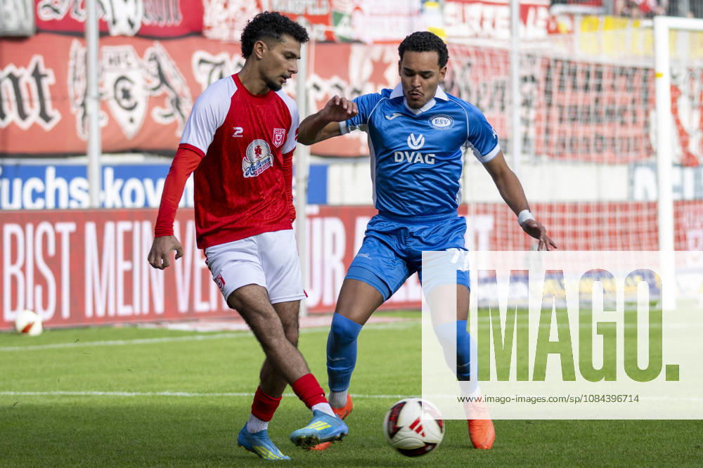 Regionalliga Northeast, Season 26-27: Hallescher FC vs. RSV Eintracht 1949 e.V., Halle, Germany, October 11, 2026. Pictured, from left, in a tackle: Osman Atilgan (Halle) and Caua (RSV Halle), Saale-Leuna Chemie Stadium, Saxony-Anhalt, Germany