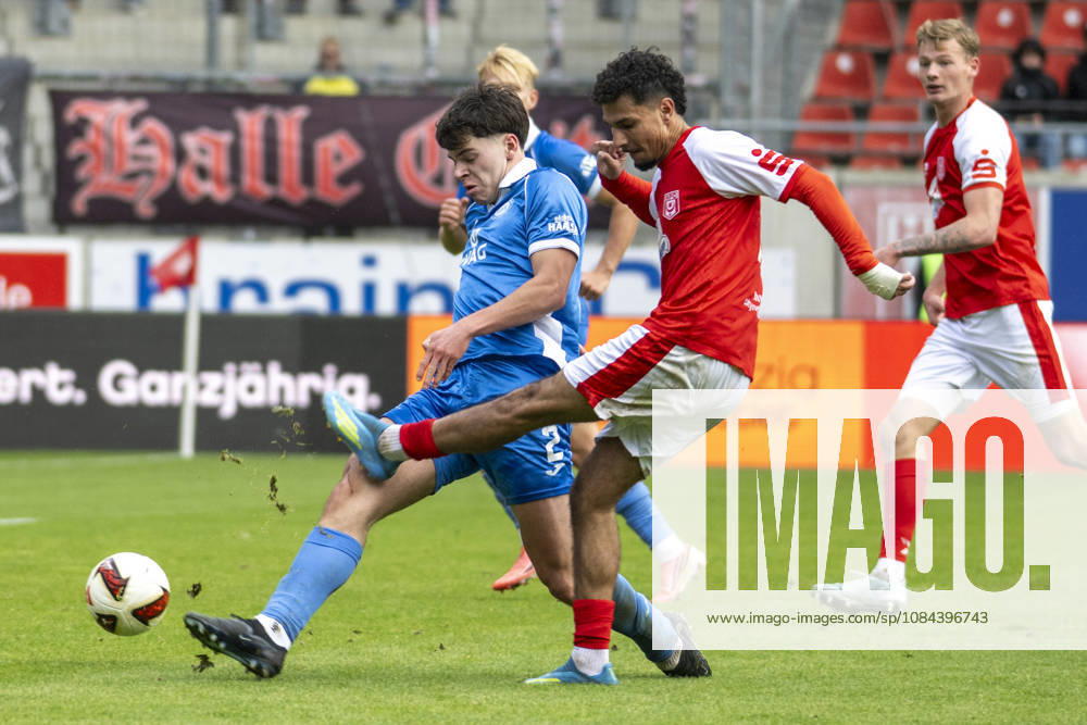 Regionalliga Northeast, Season 26-27: Hallescher FC vs. RSV Eintracht 1949 e.V., Halle, Germany, October 11, 2026. Pictured, from left, in a tackle: Kajetan Herrmann (RSV) and Osman Atilgan (Halle). Halle-Saale Leuna Chemie Stadium, Saxony-Anhalt, Germany