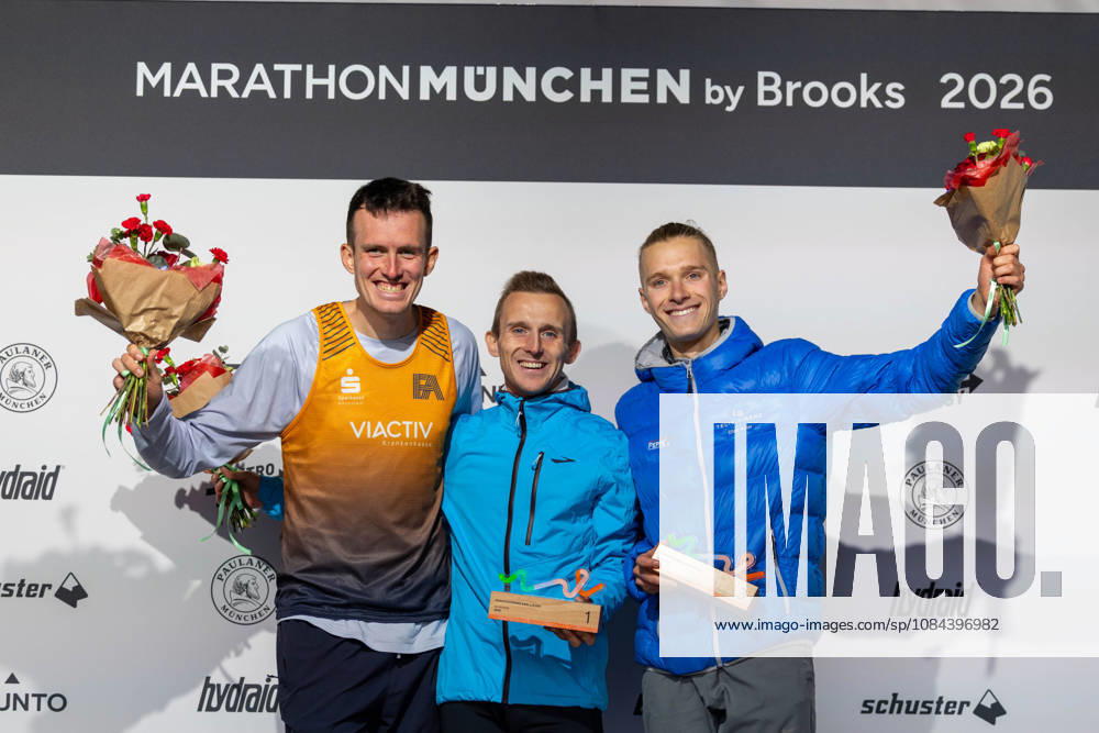 2026 Munich Marathon, Munich, October 11, 2026. The top three men, from left to right: 2nd place Niklas BUCHHOLZ (GER) Franconia Athletics, Winner Sander VERCAUTEREN (BEL) Team Brooks, 3rd place Elias KOLAR (GER) LG Telis Finanz Regensburg, beaming during the award ceremony after the 10 km race as part of the 2026 Munich Marathon, Munich