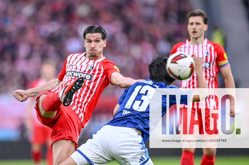 Igor Matanovic of SC Freiburg and Satoshi Tanaka of FC Schalke 04 battle for the ball during the Bundesliga match between SC Freiburg and FC Schalke 04 at Europa-Park Stadium on October 11, 2026, in Freiburg im Breisgau, Germany Photo by Harry Langer DeFodi Images Igor Matanovic of SC Freiburg and Satoshi Tanaka of FC Schalke 04 battle for the ball during the Bundesliga match between Sport Club Freiburg and FC Schalke 04 at Europa Park Stadion on October 11, 2026, in Freiburg im Breisgau, Germany. Photo by Harry Langer, DeFodi Images. DFB and DFL regulations prohibit any use of photographs as image sequences and or quasi-video. Photo by Harry Langer, DeFodi Images. DFB and DFL regulations prohibit any use of photographs as imSEQUENCES AND OR QUASI-VIDEO
