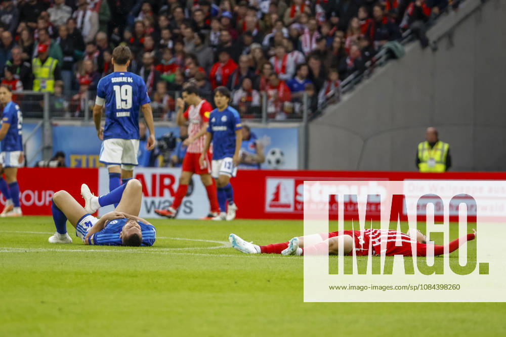 Hasan Kurucay (FC Schalke 04) and Yuito Suzuki (SC Freiburg) are injured on the ground, Germany, soccer, Bundesliga 1, Matchday 5, 2026–2027, SC Freiburg vs. FC Schalke 04, October 11, 2026, Freiburg im Breisgau, Europa-Park Stadium, Germany