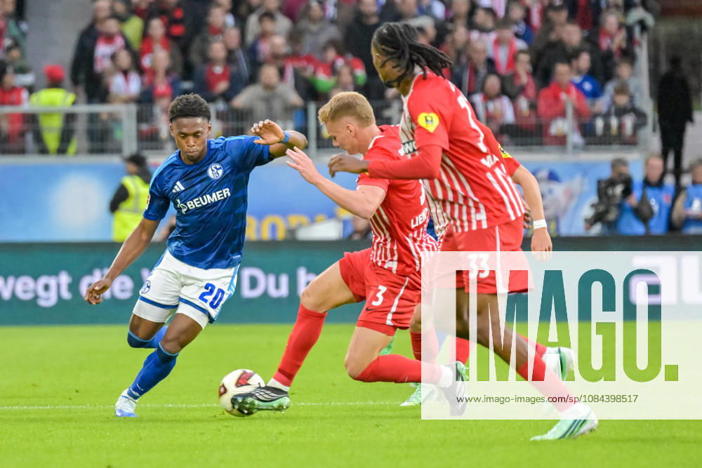 Junior Adamu, FC Schalke 04, 20, Philipp Lienhart, SC Freiburg, 03, in a duel with Jordy Makengo, SC Freiburg, 33, in the foreground, GER, SC Freiburg vs. Schalke 04, soccer, Bundesliga, Matchday 5, 2026–2027 season, October 11, 2026 DFL DFB regulations prohibit any use of photographs as image sequences and or quasi-video GER, SC Freiburg vs. Schalke 04, soccer, Bundesliga, Matchday 5, 2026–2027 season, October 11, 2026, Freiburg