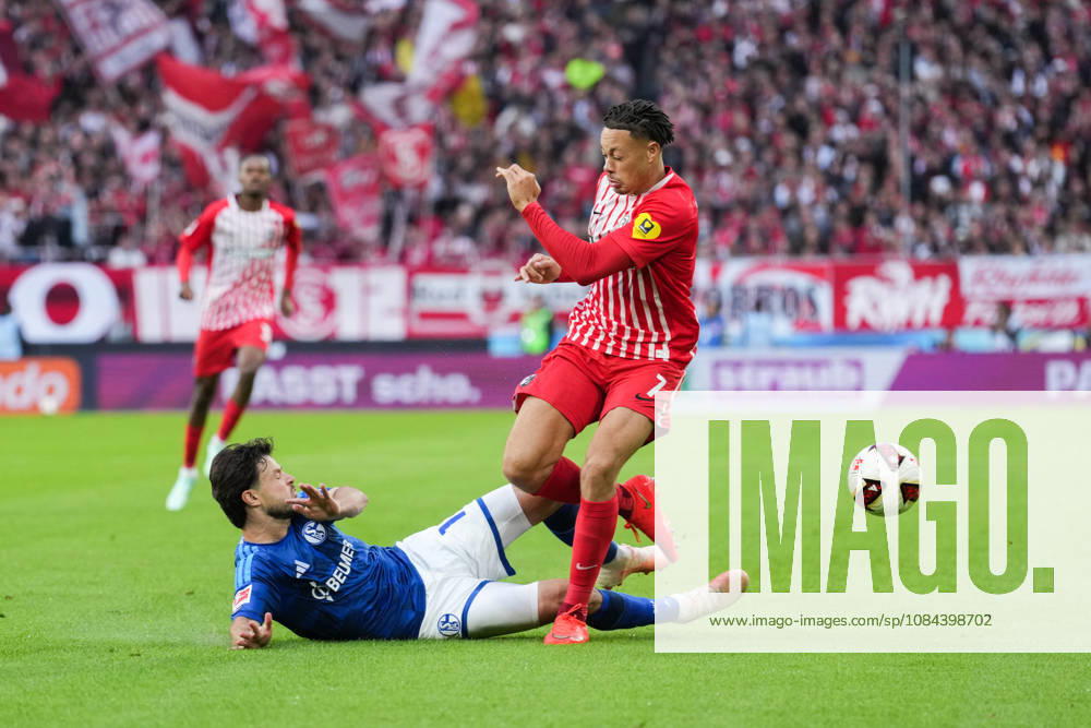 1 Bundesliga: SC Freiburg vs. FC Schalke 04, October 11, 2026; Tackle between Adrian Gantenbein (FC Schalke 04, No. 17) and Derry Scherhant (SC Freiburg, No. 7); 1 Bundesliga: SC Freiburg vs. FC Schalke 04, Europa-Park Stadium, October 11, 2026 DFB and DFL regulations prohibit any use of photographs as image sequences and or quasi-video.