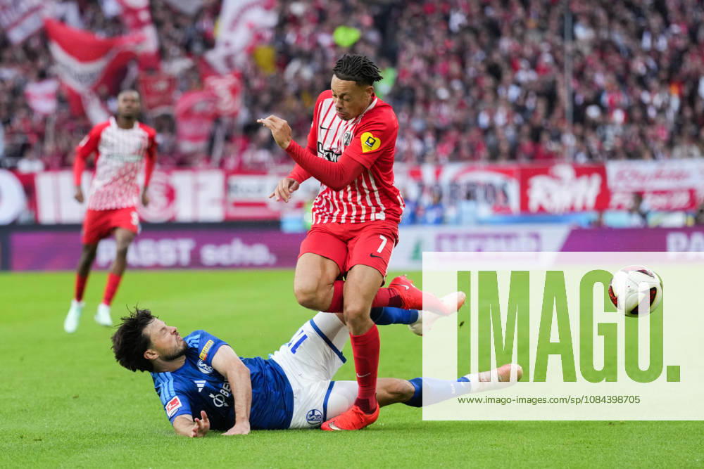 1 Bundesliga: SC Freiburg vs. FC Schalke 04, October 11, 2026; Tackle between Adrian Gantenbein (FC Schalke 04, No. 17) and Derry Scherhant (SC Freiburg, No. 7); 1 Bundesliga: SC Freiburg vs. FC Schalke 04, Europa-Park Stadium, October 11, 2026 DFB and DFL regulations prohibit any use of photographs as image sequences and or quasi-video.