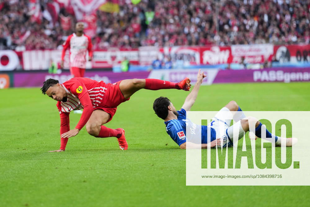 1 Bundesliga: SC Freiburg vs. FC Schalke 04, October 11, 2026; Tackle between Adrian Gantenbein (FC Schalke 04, No. 17) and Derry Scherhant (SC Freiburg, No. 7); 1 Bundesliga: SC Freiburg vs. FC Schalke 04, Europa-Park Stadium, October 11, 2026 DFB and DFL regulations prohibit any use of photographs as image sequences and or quasi-video.