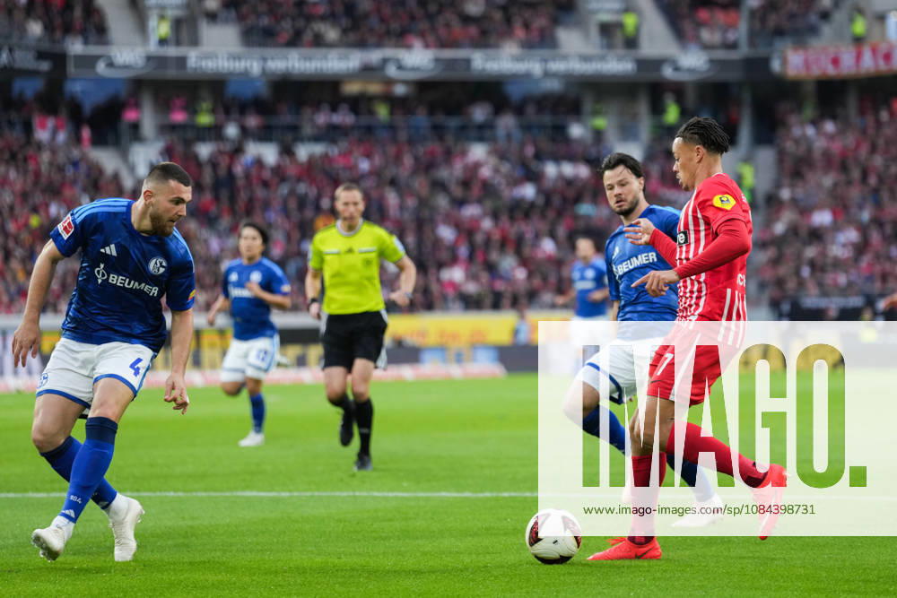 1 Bundesliga: SC Freiburg vs. FC Schalke 04, October 11, 2026; Tackle between Hasan Kurucay (FC Schalke 04, No. 4) and Derry Scherhant (SC Freiburg, No. 7); 1 Bundesliga: SC Freiburg vs. FC Schalke 04, Europa-Park Stadium, October 11, 2026 DFB and DFL regulations prohibit any use of photographs as image sequences and or quasi-video.