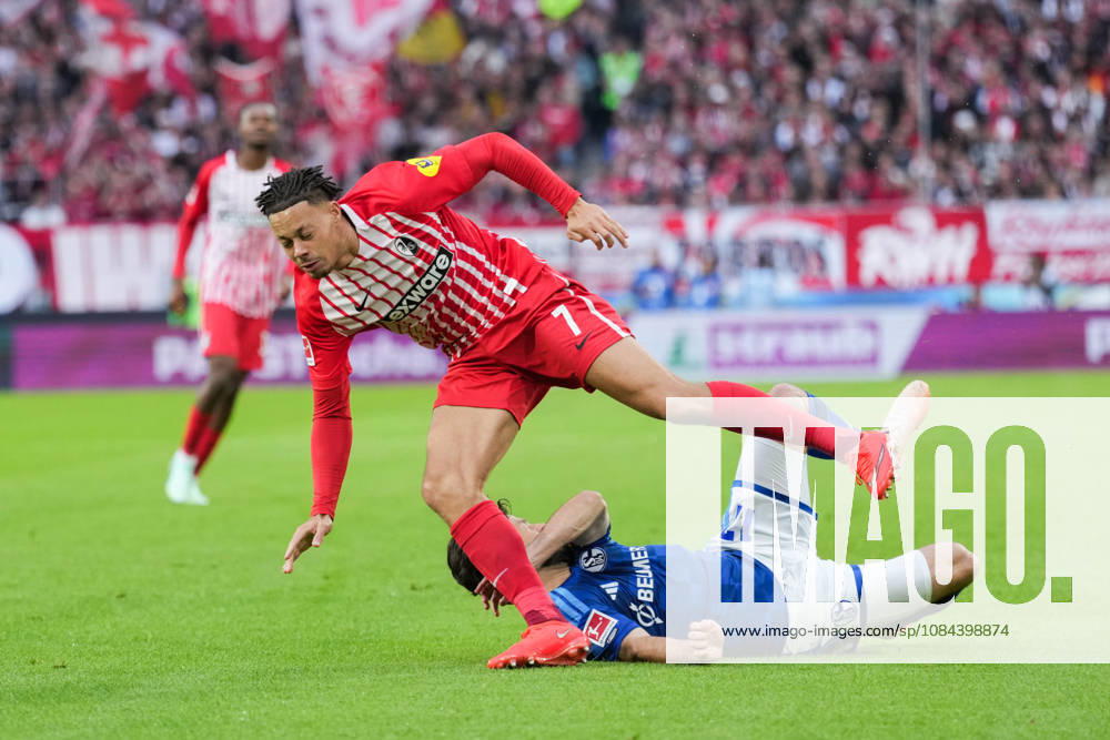 1 Bundesliga: SC Freiburg vs. FC Schalke 04, October 11, 2026; Tackle between Adrian Gantenbein (FC Schalke 04, No. 17) and Derry Scherhant (SC Freiburg, No. 7); 1 Bundesliga: SC Freiburg vs. FC Schalke 04, Europa-Park Stadium, October 11, 2026 DFB and DFL regulations prohibit any use of photographs as image sequences and or quasi-video.