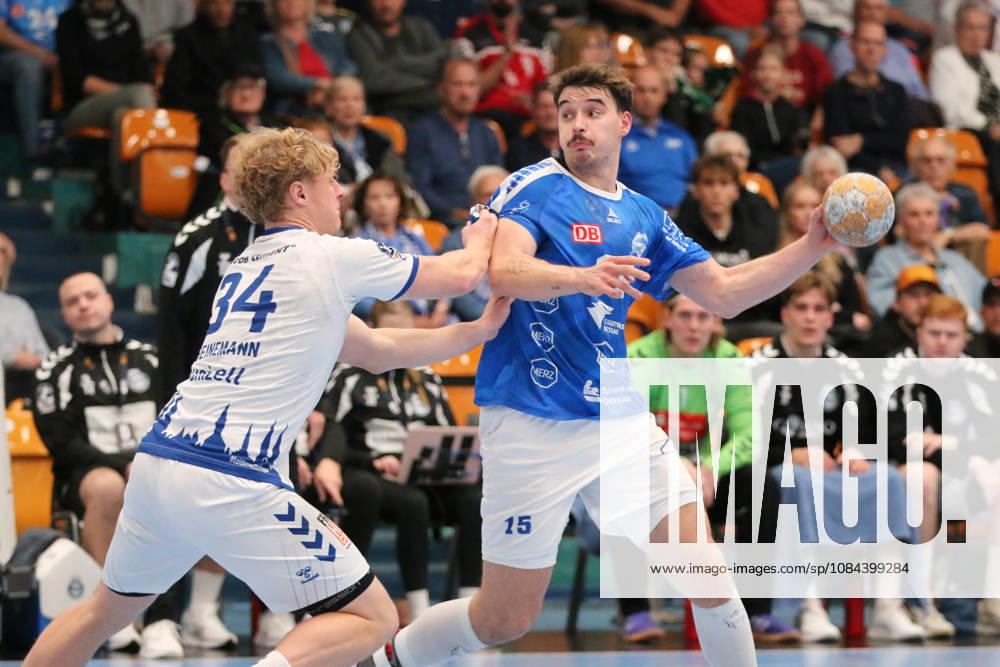 Men s Handball 2026–2027, 2nd Division, Matchday 7: Dessau Roßlauer HV 06 vs. VfL Lübeck Schwartau at Anhalt Arena, Dessau. Referee: Marcel Nowak (Dessau), 15, in blue, is disrupted on the attack by Thore Heinemann of Lübeck, 34, in white Dessau Roßlau Saxony-Anhalt Germany