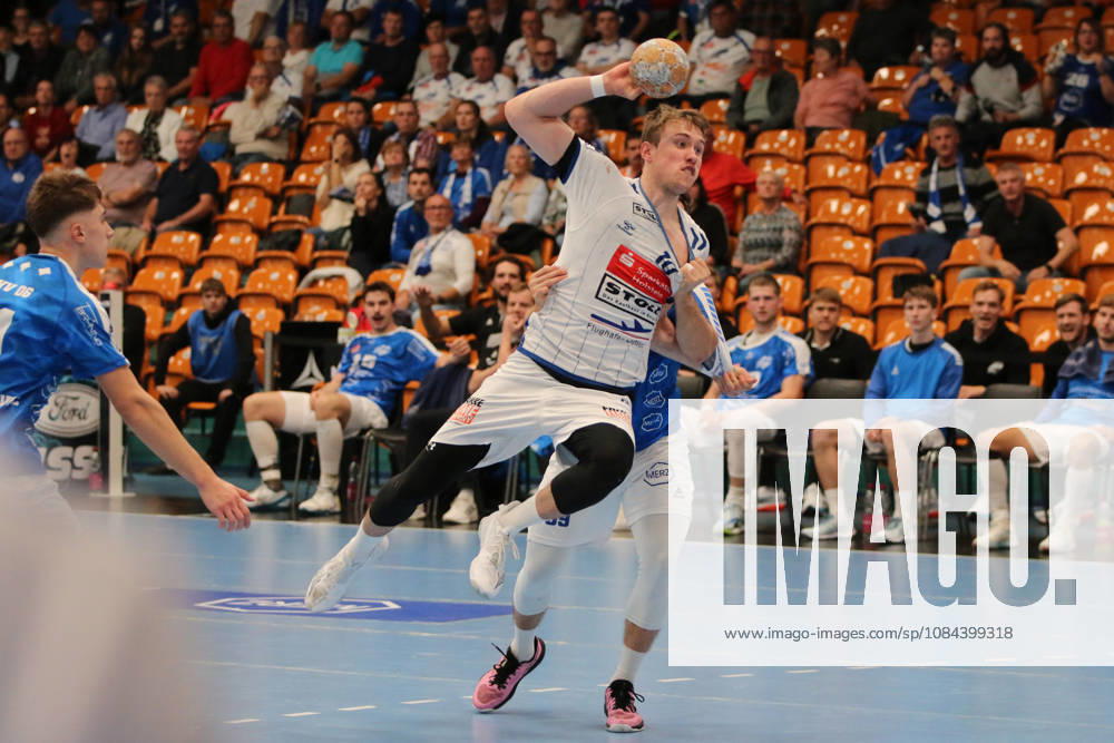 Men s Handball 2026–2027, 2nd Division, Matchday 7: Dessau Roßlauer HV 06 vs. VfL Lübeck Schwartau at Anhalt Arena, Dessau. Ole Hagedorn (Lübeck), 10, in white, is disrupted by Dessau’s 69, in blue, during a shot on goal by Niklas Döbbel Dessau, Saxony-Anhalt, Germany