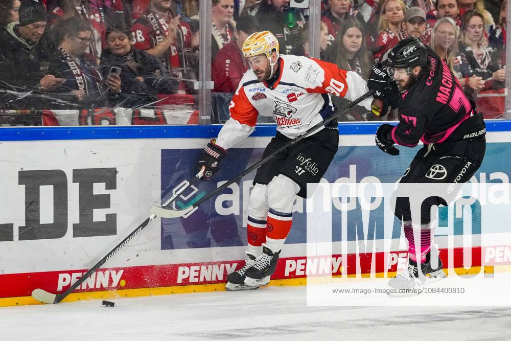 Ice Hockey: Penny DEL, Matchday 8—Cologne Sharks vs. Nuremberg Ice Tigers on October 11, 2026, at the Lanxess Arena in Cologne. Constantin Braun (Nuremberg), left: Ryan Macinnis (Cologne), right: In accordance with the regulations of the DEL (German Ice Hockey League), the publication and further use of the footage in electronic media and on devices of any kind during the game is not permitted