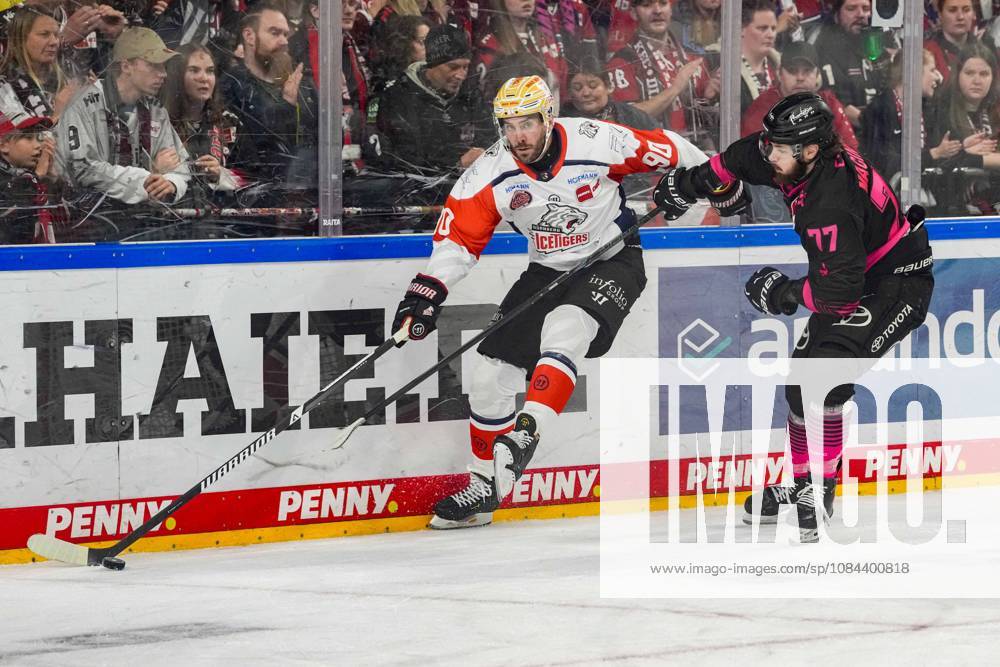 Ice Hockey: Penny DEL, Matchday 8—Cologne Sharks vs. Nuremberg Ice Tigers on October 11, 2026, at the Lanxess Arena in Cologne. Constantin Braun (Nuremberg), left: Ryan Macinnis (Cologne), right: In accordance with the regulations of the DEL (German Ice Hockey League), the publication and further use of the footage in electronic media and on devices of any kind during the game is not permitted