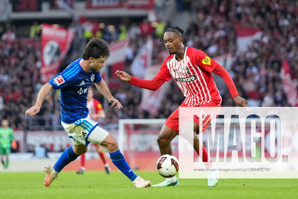 Adrian Gantenbein (FC Schalke 04), No. 17, in a tackle with Jordy Makengo (SC Freiburg), No. 33, Germany, Soccer, Bundesliga 1, Matchday 5, 2026–2027, SC Freiburg vs. FC Schalke 04, October 11, 2026, Europa-Park Stadium, Freiburg, Freiburg, Europa-Park Stadium, Baden-Württemberg, Germany