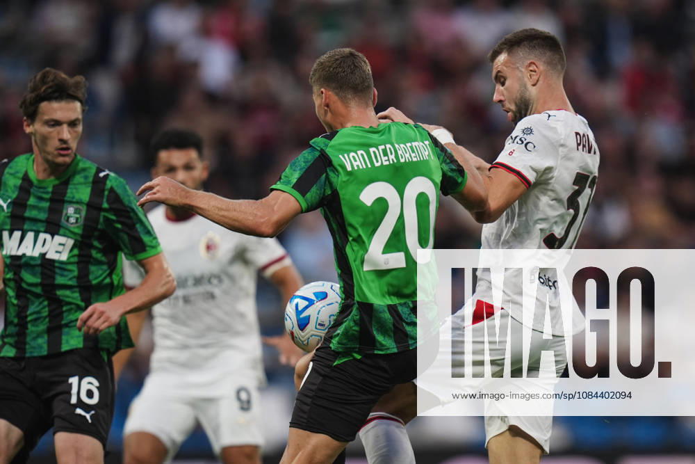 Milan s Strahinja Pavlovic fights for the ball with Sassuolos Ignace Van der Brempt during the Serie A soccer match between Sassuolo and Milan at the Mapei Stadium in Reggio Emilia, north Italy - Sunday, October 11, 2026 -