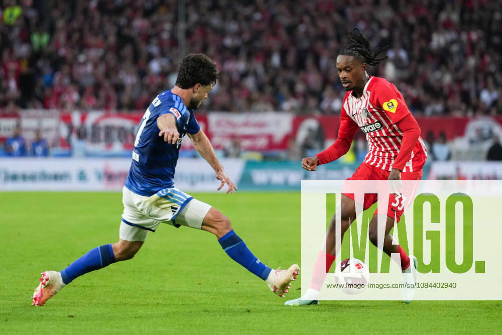 1 Bundesliga: SC Freiburg vs. FC Schalke 04, October 11, 2026—A tackle between Adrian Gantenbein (FC Schalke 04, No. 17) and Jordy Makengo (SC Freiburg, No. 33). 1 Bundesliga: SC Freiburg vs. FC Schalke 04, Europa-Park Stadium, October 11, 2026 DFB and DFL regulations prohibit any use of photographs as image sequences and or quasi-video.