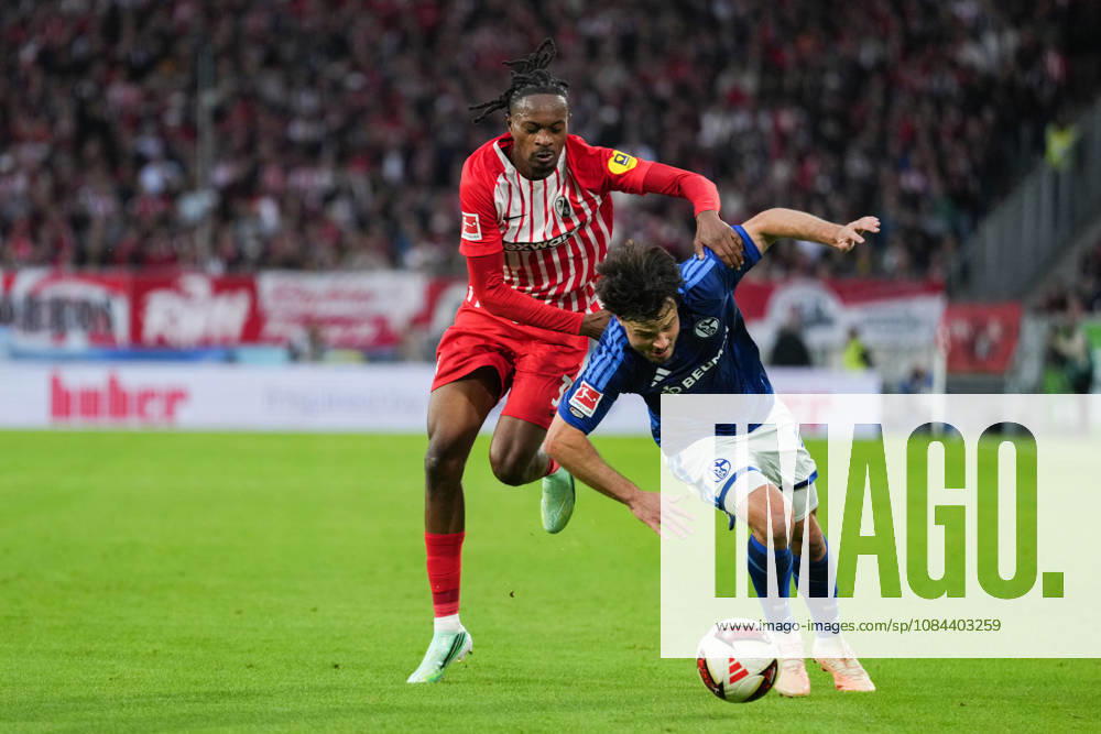 1 Bundesliga: SC Freiburg vs. FC Schalke 04, October 11, 2026—A tackle between Adrian Gantenbein (FC Schalke 04, No. 17) and Jordy Makengo (SC Freiburg, No. 33). 1 Bundesliga: SC Freiburg vs. FC Schalke 04, Europa-Park Stadium, October 11, 2026 DFB and DFL regulations prohibit any use of photographs as image sequences and or quasi-video.