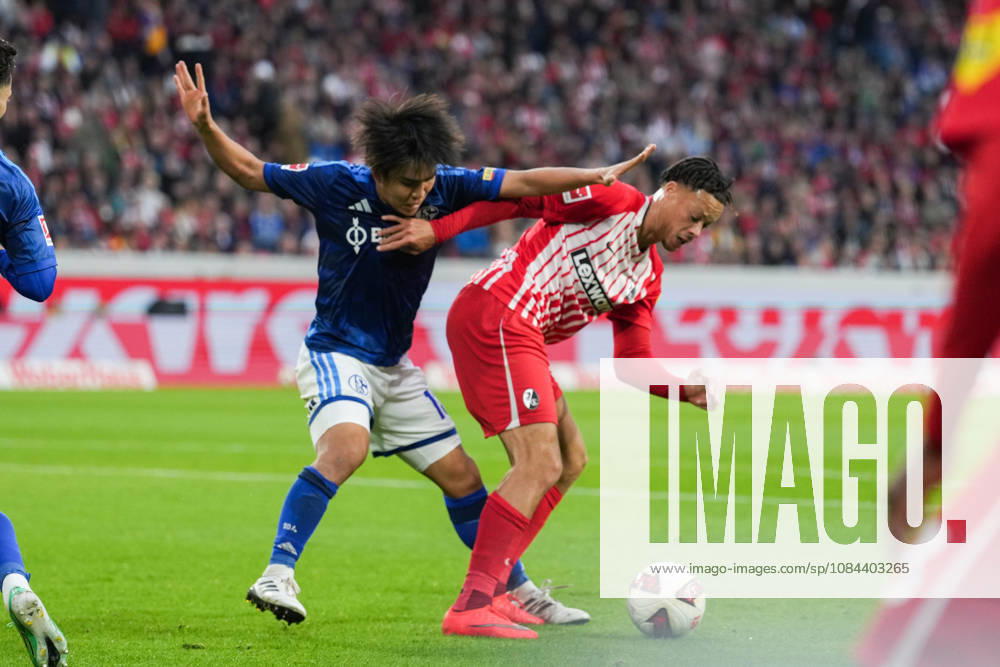 1 Bundesliga SC Freiburg vs. FC Schalke 04, October 11, 2026: A duel between Satoshi Tanaka (FC Schalke 04, No. 13) and Derry Scherhant (SC Freiburg, No. 7) 1 Bundesliga SC Freiburg vs. FC Schalke 04, Europa-Park Stadium, October 11, 2026 DFB and DFL regulations prohibit any use of photographs as image sequences and or quasi-video.