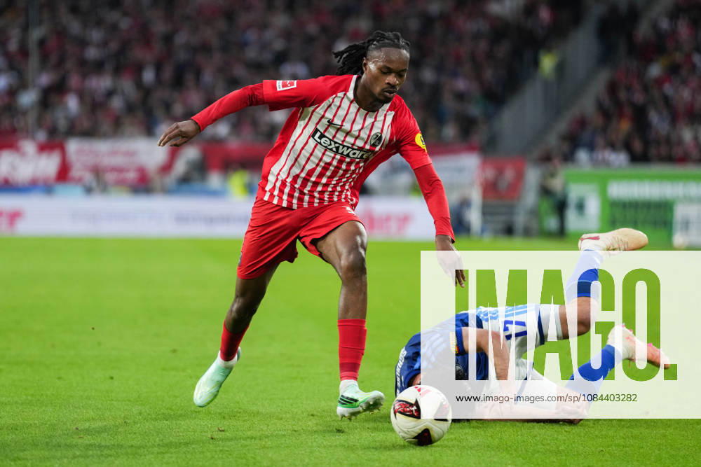 1 Bundesliga: SC Freiburg vs. FC Schalke 04, October 11, 2026—A tackle between Adrian Gantenbein (FC Schalke 04, No. 17) and Jordy Makengo (SC Freiburg, No. 33). 1 Bundesliga: SC Freiburg vs. FC Schalke 04, Europa-Park Stadium, October 11, 2026 DFB and DFL regulations prohibit any use of photographs as image sequences and or quasi-video.