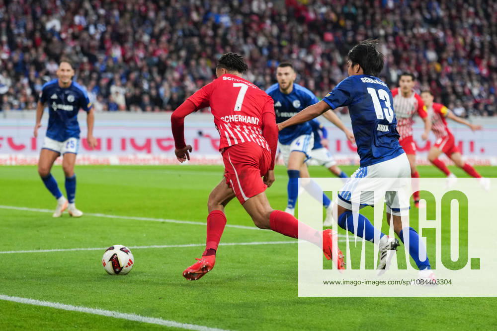 1 Bundesliga: SC Freiburg vs. FC Schalke 04, October 11, 2026; Tackle between Satoshi Tanaka (FC Schalke 04, No. 13) and Derry Scherhant (SC Freiburg, No. 7); 1 Bundesliga: SC Freiburg vs. FC Schalke 04, Europa-Park Stadium, October 11, 2026 DFB and DFL regulations prohibit any use of photographs as image sequences and or quasi-video.