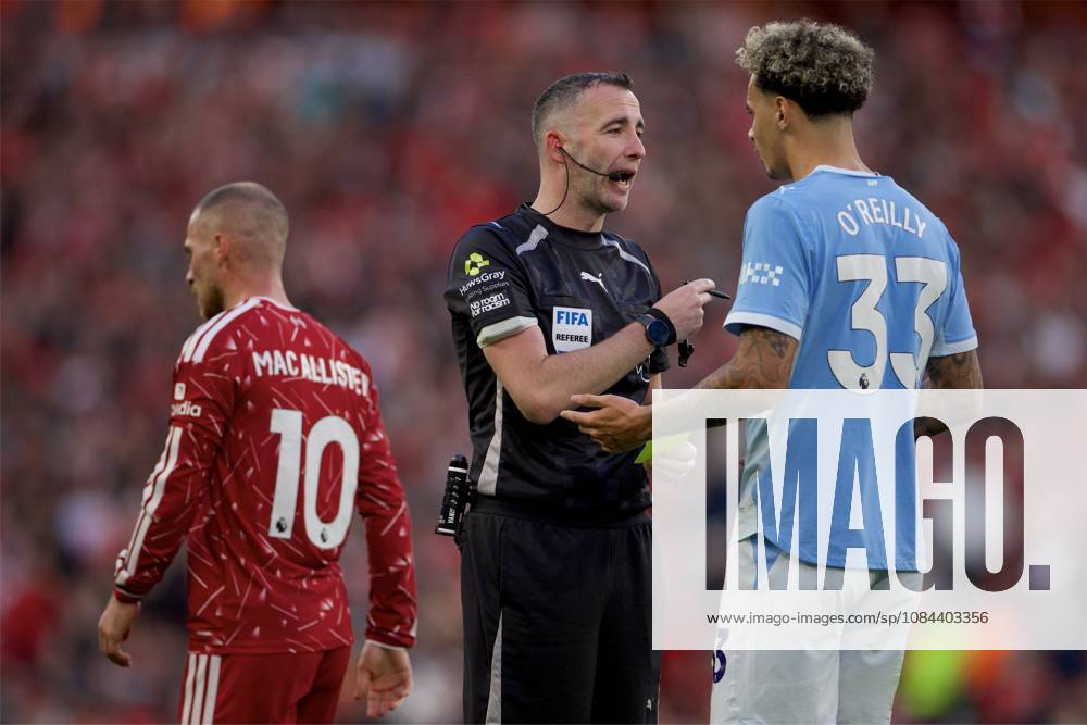 Football - FA Premier League - Liverpool FC v Manchester City FC LIVERPOOL, ENGLAND - Sunday, October 11, 2026: Referee Chris Kavanagh shows Manchester City s Nico O Reilly (R) a yellow card during the FA Premier League match between Liverpool FC and Manchester City FC at Anfield. (Photo by David Rawcliffe Propaganda) LIVERPOOL Anfield MERSEYSIDE ENGLAND