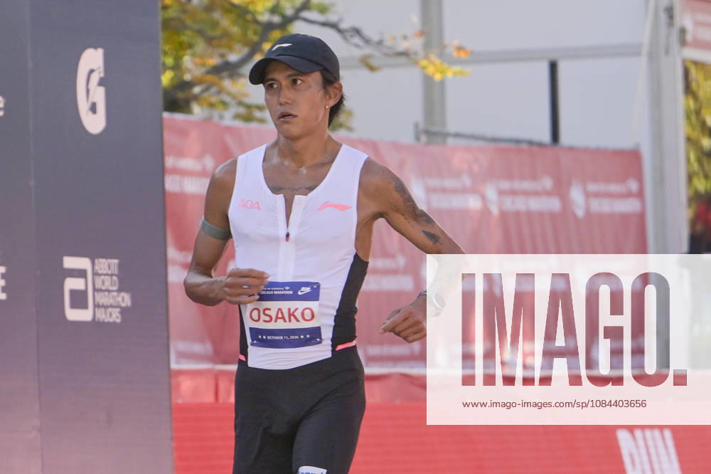 Suguru Osako of Japan crosses the finish line with a time of 02:07:34 placing 14th over all during 2026 Bank of America Chicago Marathon in Chicago on Sunday, Oct. 11, 2026. CHI20261011108 MARKxBLACK